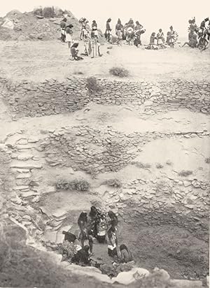 Imagen del vendedor de Preparing for oraile flute ceremony - Flute dancers are seen preparing for the ceremony near an altar. One bears an emblem of the sun. At the foot of the steps a man and woman are attiring a girl, while a little naked child looks on a la venta por Antiqua Print Gallery