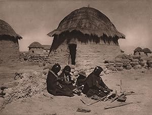 Chipaya Indians in front of their house in the southern part of the Province of Carangas. This tr...