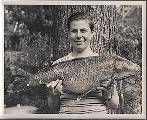 Image du vendeur pour Young man holding a large carp vernacular news photo by Ted Kosinski 1950s mis en vente par The Jumping Frog