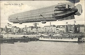 Ansichtskarte / Postkarte Köln am Rhein, Zeppelin, Badeanstalt, Schiffbrücke, Teilansicht der Stadt