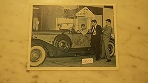 Imagen del vendedor de SIGNED BY EDD KOOKIE BYRNES B/W PHOTOGRAPH OF HIM SITTING IN CONVERTIBLE CAR & THE OTHER 2 STAR DETECTIVE EFFREN ZIMBALIST JR & ROGER SMITH FROM OF TV SHOW 77 SUNSET STRIP STANDING BESIDE THE CAR, EARLY 1960'S a la venta por Bluff Park Rare Books