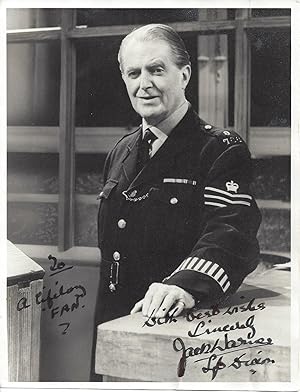 Imagen del vendedor de [ I have never felt more like chucking my hand in : Jack Warner, English actor.] Typed Letter Signed to W. J. Macqueen-Pope ( Popie ), regarding a bad bout of the flu, with signed publicity photograph in the part of Dixon of Dock Green. a la venta por Richard M. Ford Ltd