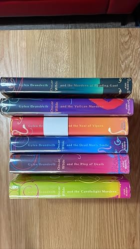 Imagen del vendedor de Oscar Wilde and the Candlelight Murders, Ring of Death, Dead Man?s Smile, Nest of Vipers, Vatican Murders and Murders at Reading Gaol. A set of signed (2 also lined) UK first editions, first printings of the first 6 Giles Brandreth Oscar Wilde novels. a la venta por Signed and Delivered Books