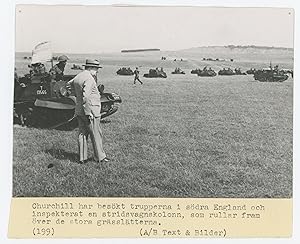 An original Second World War press photograph of Prime Minister Winston S. Churchill observing ar...