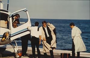 Original large format color photograph of Alain Delon getting off a helicopter at Cannes.