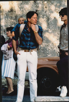 Original large format close-up color photograph of Peter Strauss with son Justin on his back at C...