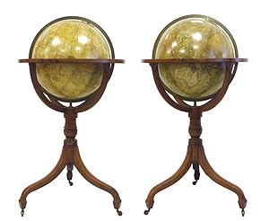 An exceptional matching pair of Regency period floor 18" globes, one terrestrial and one celestial,