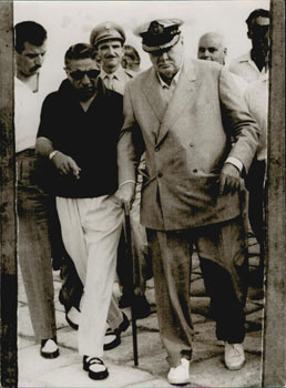 Seller image for Sir Winston Churchill being physically supported by Aristotle Onassis in Itea (Delphes), Greece. Original photograph. for sale by Wittenborn Art Books