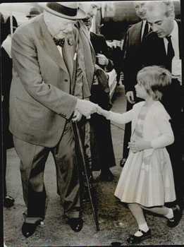 Seller image for Sir Winston Churchill shaking hands with his private secretary's young daughter on his arrival in London from the USA. Original photograph. for sale by Wittenborn Art Books