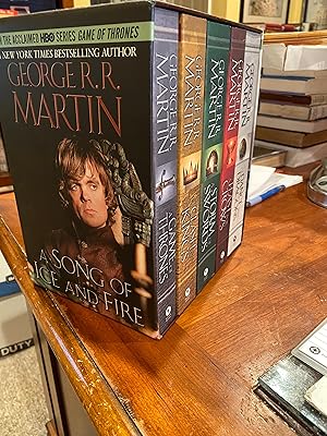 Seller image for THE SONG OF FIRE AND ICE ( 5 volume PB in slipcase -The Game of Thrones-Clash of Kings-A storm of Swords-Feast for Crows-A dance with dragons) for sale by Happy Heroes