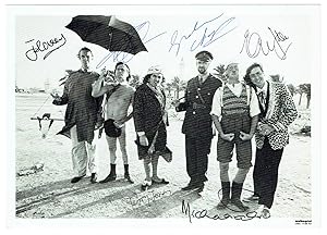 Signed paperstock photograph by all 6 members.