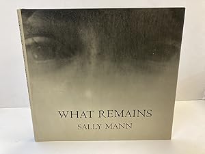 WHAT REMAINS [SIGNED]