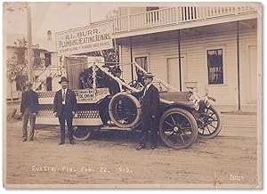 1915 Photograph of Eustis, Florida showing a local business car festooned for President's Day