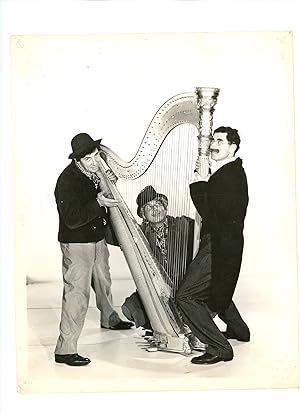 Promotional Still Photograph of the Marx Brothers Gathered around a Harp