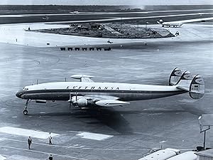 Imagen del vendedor de 1970s Glossy Black and White Photo of a Lufthansa Super Constellation (L-1049G) Jet In Flight a la venta por 32.1  Rare Books + Ephemera, IOBA, ESA