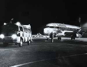 1970s Glossy Black and White Photo of a Lufthansa Boeing 737 "City Jet" at Night