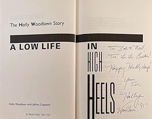 Bild des Verkufers fr The Holly Woodlawn Story. A Low Life in High Heels. [Signed] zum Verkauf von William Chrisant & Sons, ABAA, ILAB. IOBA, ABA, Ephemera Society