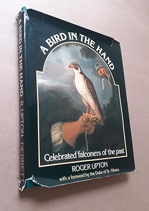 Seller image for A BIRD IN THE HAND: CELEBRATED FALCONERS OF THE PAST. By Roger Upton. for sale by Coch-y-Bonddu Books Ltd