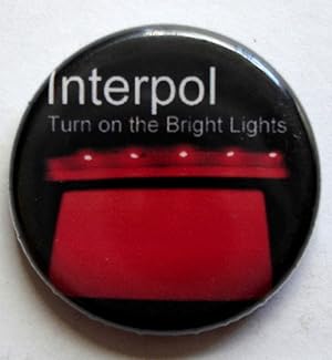 Bild des Verkufers fr Interpol 'Turn on the Bright Lights' Vintage Pin zum Verkauf von Silicon Valley Fine Books