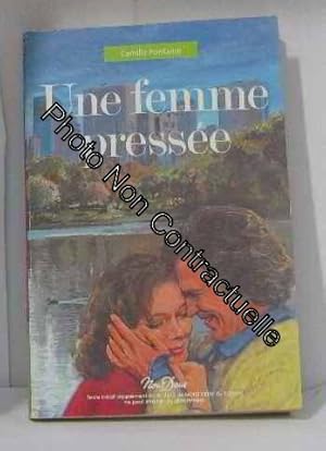 Seller image for Une femme presse for sale by Dmons et Merveilles