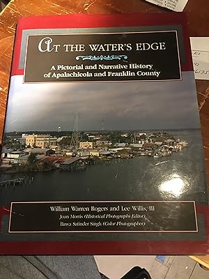 Bild des Verkufers fr Signed. At the Water's Edge: A Pictorial and Narrative History of Apalachicola and Franklin County zum Verkauf von Bristlecone Books  RMABA