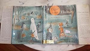 Seller image for A TIGER CALLED THOMAS - by Charlotte Zolotow ILLUSTRATED BY Kurt Werth 1963, 1ST EDITION, , Rare IN DUSTJACKET, ABOUT Lonely CHILDREN WHO Like Thomas are held back by Shyness from making friends, Thomas Little boy was so afraid that the People in new Neighborhood for sale by Bluff Park Rare Books