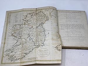 Bild des Verkufers fr TOPOGRAPHIA HIBERNICA; OR THE TOPOGRAPHY OF IRELAND, ANTIENT AND MODERN, GIVING A COMPLETE VIEW OF THE CIVIL AND ECCLESIASTICAL STATE OF THAT KINGDOM; WITH ITS ANTIQUITIES, NATURAL CURIOSITIES, TRADE, MANUFACTURES, EXTENT AND POPULATION. ITS COUNTIES, BARONIES, CITIES, BOROUGHS, PARLIAMENTARY REPRESENTATION AND PATRONAGE; ANTIENT DISTRICTS AND THEIR ORIGINAL PROPRIETORS. POST, MARKET AND FAIR TOWNS; BISHOPRICKS, ECCLESIATICAL BENEFICES, ABBIES, MONASTERIES, CASTLES, RUINS, PRIVATE-SEATS, AND REMARKABLE BUILDINGS. MOUNTAINS, RIVERS, LAKES, MINERAL-SPRINGS, BAYS AND HARBOURS, WITH THE LATITUDE AND LONGITUDE OF THE PRINCIPAL PLACES, AND THEIR DISTANCES TO THE METROPOLIS, AND FROM EACH OTHER. THE WHOLE ALPHABETICALLY ARRANGED AND CAREFULLY COLLECTED. WITH AN APPENDIX CONTAINING SOME ADDITIONAL PLACES AND REMARKS, AND SEVERAL USEFUL TABLES zum Verkauf von Aardvark Rare Books, ABAA