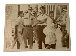 Going to Class under Guard. AP Wirephoto. Aug. 28, 1969. New Iberia, La. Photo of two African Ame...