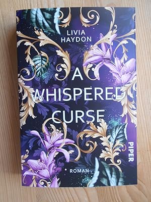 A whispered curse : Roman.