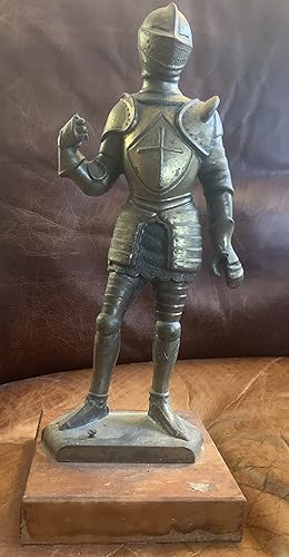 Solid Metal Knight. Standing on Wood. Ten pounds One foot tall. Circa 1950 Sword and Spear missing