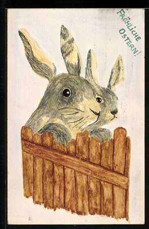 Künstler-Ansichtskarte Handgemalt: Osterhasen schauen über einen Zaun