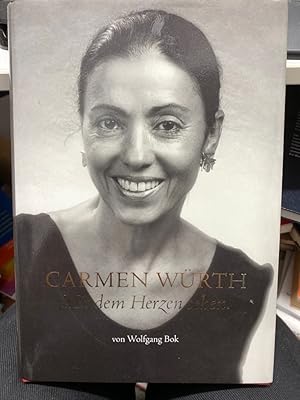 Bild des Verkufers fr Carmen Wrth : mit dem Herzen sehen. Diese Biografie ist keine gewhnliche Lebensbeschreibung. Sie ist weit mehr: eine Anleitung fr Glckssucher. Carmen Wrth weist dafr einen Weg. Ihr Einsatz fr geistig und krperlich behinderte Menschen ffnet Augen und Herzen. Mit dem von ihr gegrndeten Hotel-Restaurant Anne-Sophie in Knzelsau frdert sie das Miteinander von Menschen mit und ohne Handicap. Hier wird Integration gelebt und Freude vermittelt. Diese als  ausgewhlter Ort" prmierte Einrichtung ist Beispiel gebend fr eine Integration, die emotionale Hrden abbaut und dem Leben einen tieferen Sinn gibt. Der renommierte Journalist Wolfgang Bok portrtiert die Frau, die viel mehr ist als die Gattin eines bekannten Unternehmers: nmlich eine Unternehmerin der guten Tat. Briefe von Familienmitgliedern, Freunden und Wegbegleitern ergnzen diese spannende Lebensbeschreibung und geben ihr eine ganz persnliche Note. zum Verkauf von bookmarathon