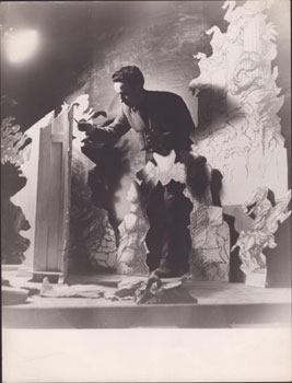 Original photograph of the artist André Beaurepaire creationg a stage set.