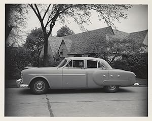 Collection of 13 original photographs of a Packard 200, documenting the car's performance during ...