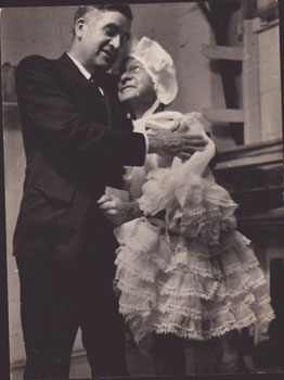 Image du vendeur pour Original photograph of Downey Harvey of the Bohemian Club in drag hugging a member in suit. Signed and dated. mis en vente par Wittenborn Art Books