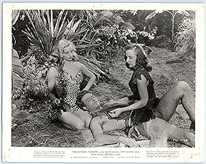 Seller image for Prehistoric Women - 8x10 Movie Still - Feeding the Captured Man for sale by Top Notch Tomes