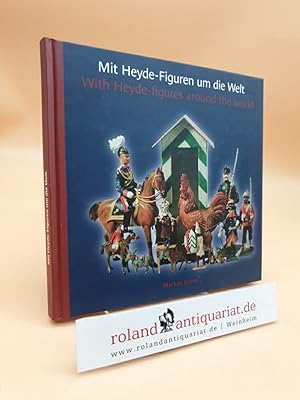 Seller image for Mit Heyde-Figuren um die Welt = With Heyde-figures around the world Markus Grein. [bers.: Ulrich Ott] for sale by Roland Antiquariat UG haftungsbeschrnkt