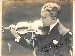 Immagine del venditore per [Charlie Chaplin [Sir Charles Spencer Chaplin], English comedian, star of the silent screen.] Autograph Signature to matt bromide print of portrait by Witzel of Los Angeles of Chaplin playing his violin. venduto da Richard M. Ford Ltd