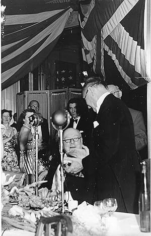 Seller image for [Sir Winston Churchill, British statesman who led the country to victory during the Second World War.] Two black and white prints of Churchill in evening dress, at a post-war function. for sale by Richard M. Ford Ltd