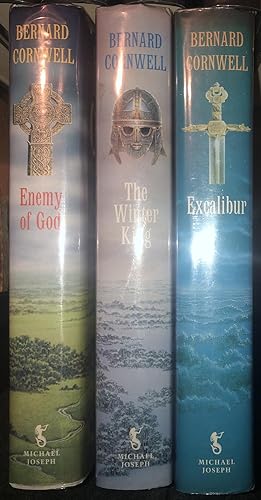 Immagine del venditore per THE WARLORD TRILOGY COMPLETE, Complete set in Three Volumes: The Winter King; Enemy of God; & Excalibur. All First Edition With Dustwrappers. VG+ venduto da Ely Books