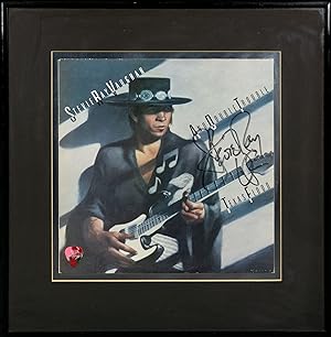 Stevie Ray Vaughan and Double Trouble. Texas Flood [a signed album sleeve mounted with an origina...
