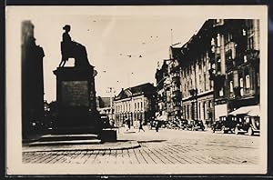 Ansichtskarte Posen, Strassenpartie mit Denkmal