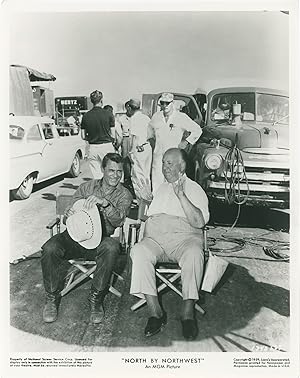 Imagen del vendedor de North By Northwest (Original photograph of Alfred Hitchcock and Cary Grant on the set of the 1959 film) a la venta por Royal Books, Inc., ABAA