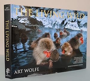 Seller image for The Living Wild: Photographs by Art Wolfe. Essays by William Conway, Richard Dawkins, Jane Goodall, John C. Sahwill, George B. Schaller, Science Advisor Gary M. Stolz for sale by Antikvariat Valentinska
