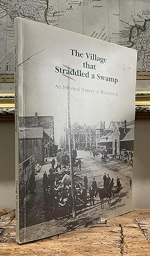 Seller image for The Village That Straddled a Swamp: An Informal History of Woodstock. [signed] for sale by CARDINAL BOOKS  ~~  ABAC/ILAB