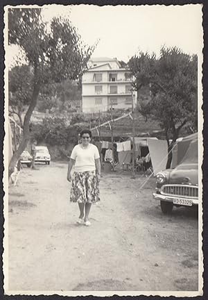 Italy 1960, Liguria, Woman strolling among bungalows, Vintage photography