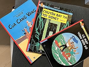 Bild des Verkufers fr Set of 3 Tintin books in Vietnamese from Vietnam. The Crab With The Golden Claws, The Red Sea Sharks and Flight 714. Tintin Foreign Languages (Langues trangres) zum Verkauf von CKR Inc.