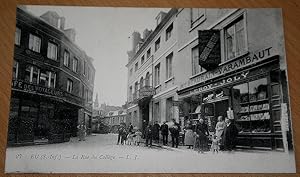 Carte Postale Ancienne - EU- LA RUE DU COLLEGE LIBRAIRIE MARCHAND DE CARTES LEROY JOLY.