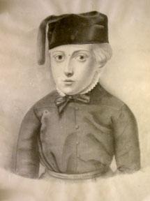 Portrait of a boy with a cap and tassle.