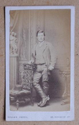 Bild des Verkufers fr Carte De Visite Photograph. Portrait of a Gentleman Wearing Riding Boots & Standing Beside a Chair. zum Verkauf von N. G. Lawrie Books